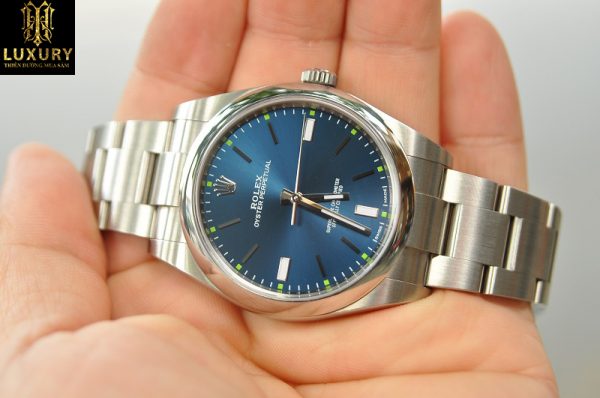 Đồng hồ Rolex Oyster Perpetual Steel 114300 mặt xanh - HT Luxury